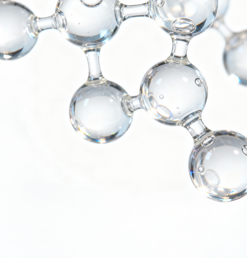 Close-up of glossy, transparent molecular spheres representing cholesterol and fatty acids used in COSRX barrier care formulas; visual emphasizes their role in supporting barrier repair, improving elasticity, and enhancing resilience for dry, sensitive, or weakened skin in need of soothing hydration and structural reinforcement.